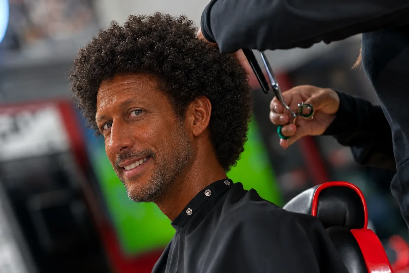 A stylist cutting a client’s hair